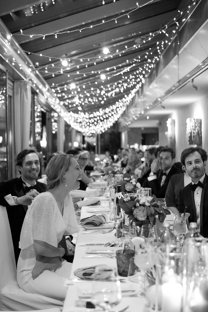 Celebreting wedding under lights during dinner time.