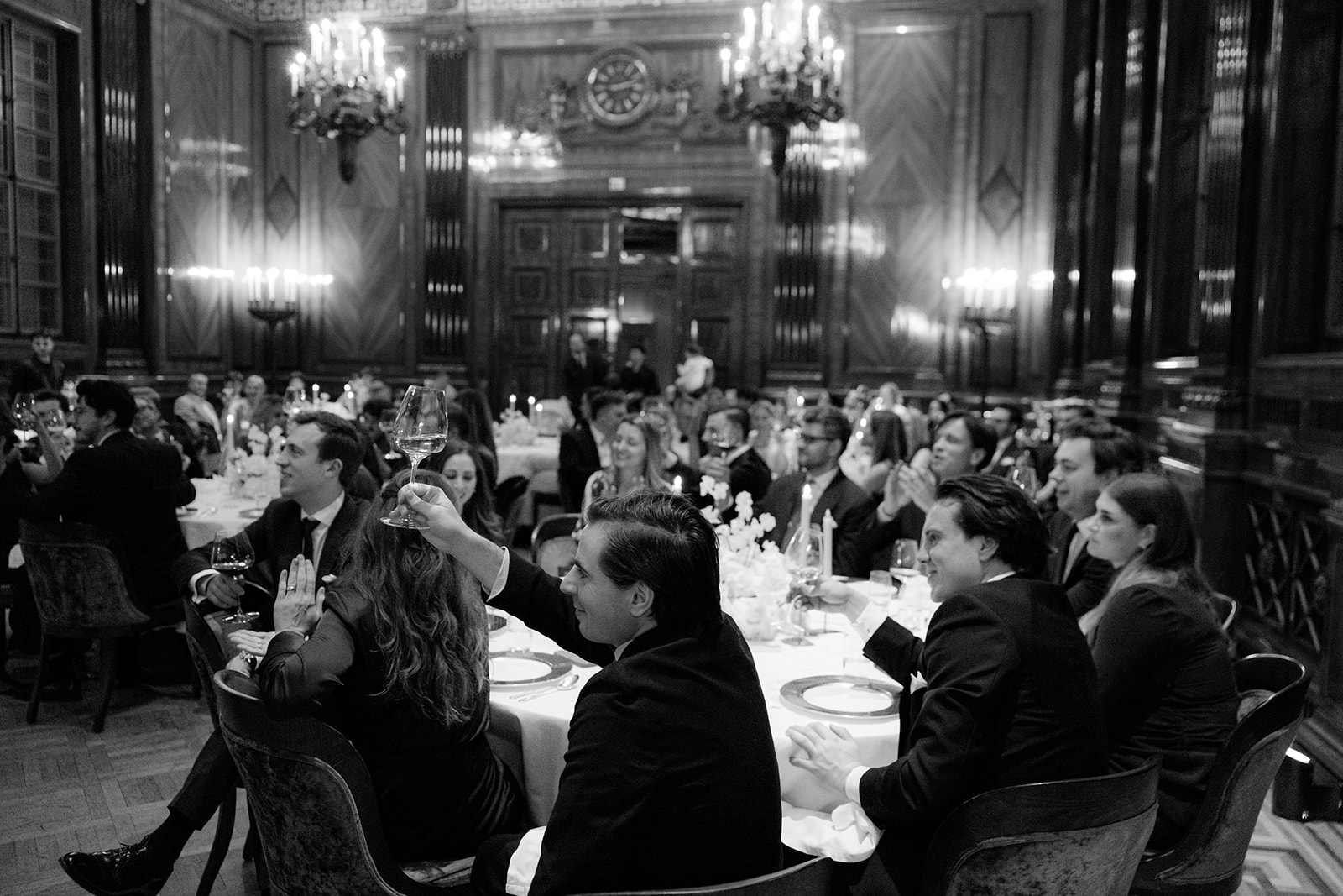 Black and white photo of guests at the wedding dinner in the ballroom of Park Hyatt Vienna